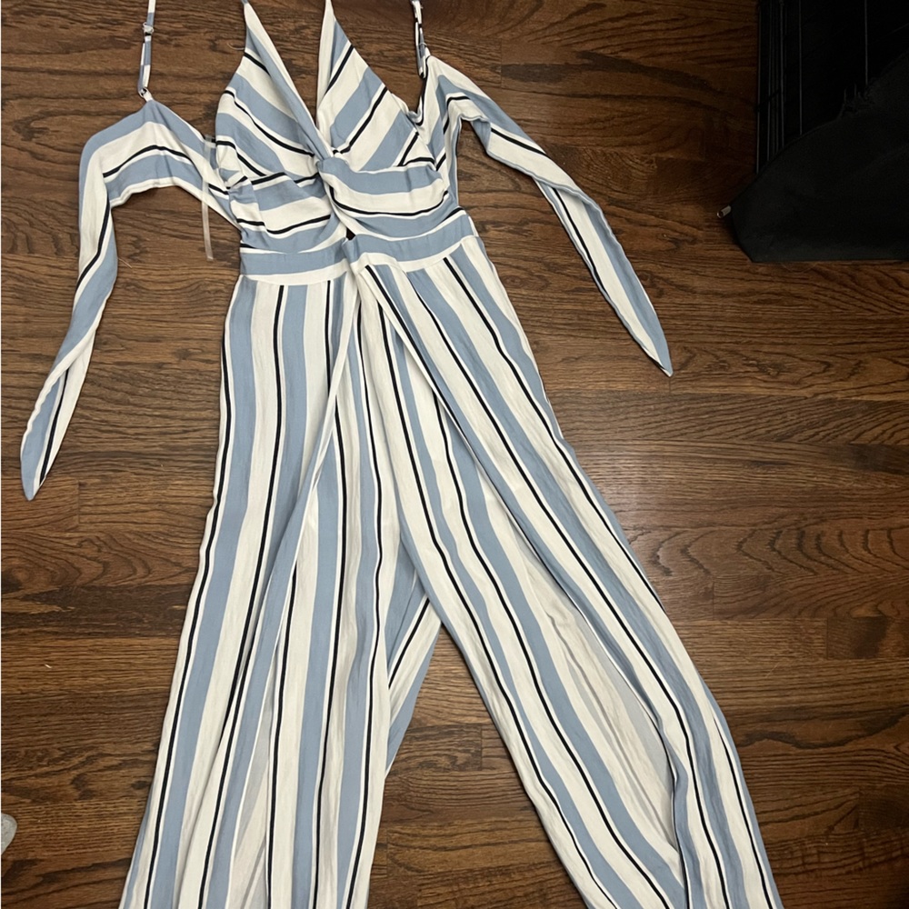 Beautiful blue striped jumpsuit with flyaway pants and tie in the back.